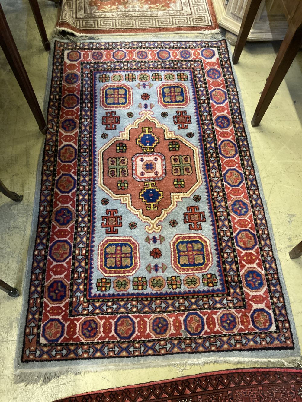 A Caucasian design rug, 150 x 94cm together with a smaller Chinese rug and a small Bokhara rug